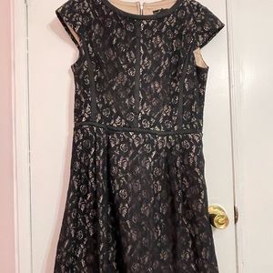 Black lace over nude lining. Very chic and sophisticated.